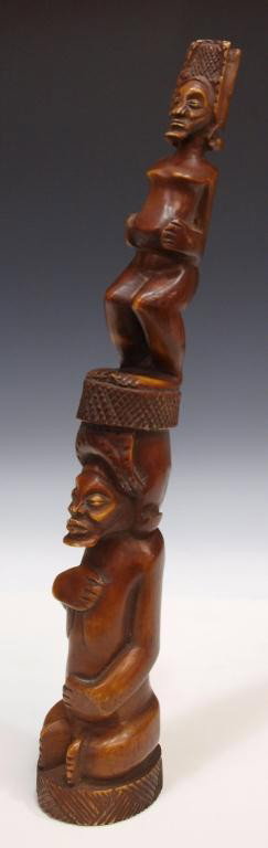 AFRICAN CARVED IVORY FIGURAL TUSK: ***NOTE--This item will not be shipped outside of the United States--There will be no International shipping on this item***African carved ivory figural sculpture, the smaller female figure set atop t