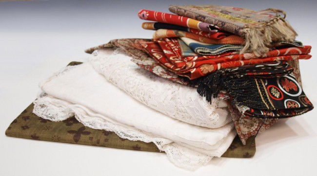 LARGE GROUP ASIAN & OTHER LACE TEXTILES: (lot) Large group Asian and other textiles, mostly for the table, includes small table runners and place mats, some silk, lot includes two white lace tablecloths, 10.25lbs total Start Price: $80.00