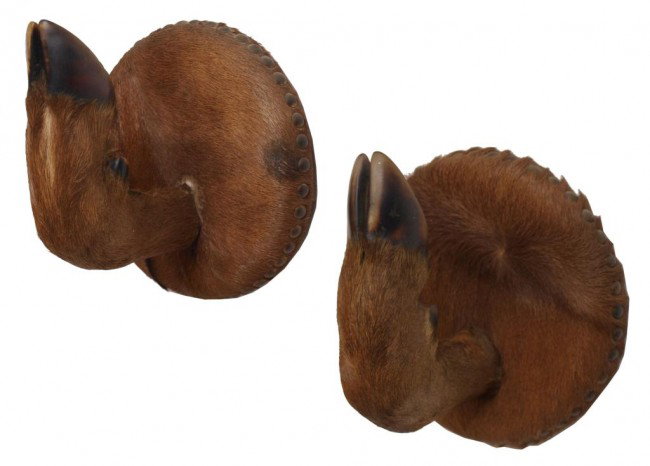 VINTAGE SPANISH DEER HOOF COAT OR HAT HOOKS: (pair) Vintage coat or hat hooks, cloven hooves center circular plaques wrapped in deer hide and set with brass buttons, sticker on back reading "Creaciones Herga, Spain", 8"h, 7.5"w, 7"d, 3lbs Start 