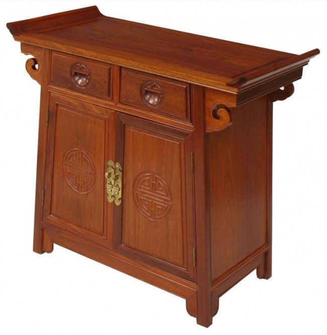 CHINESE ROSEWOOD ALTAR CABINET: Chinese rosewood altar cabinet, tapered form having a rectangular top with scroll ends over two drawers with two lower doors, raised on block feet Start Price: $150.00