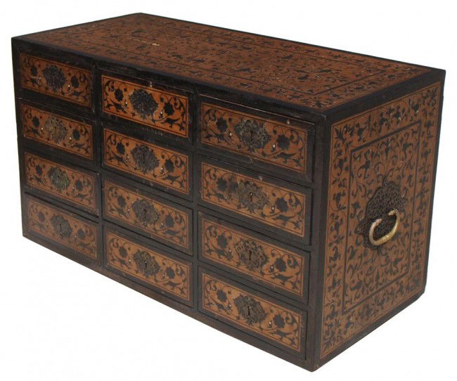 IMPORTANT 17TH C INDO-PORTUGUESE CONTADOR BOX: An important Indo-Portuguese contador box, late 17th c., the large structure fashioned from teakwood with elaborate inlays of ebony on four sides, drawers conforming in decoration set with brass escut
