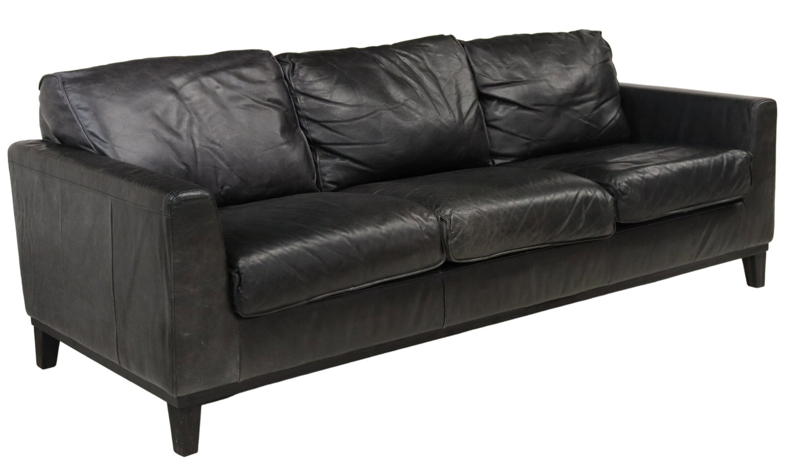 CONTEMPORARY LEATHER UPHOLSTERED THREE-SEAT SOFA: Contemporary leather three-seat sofa, 21st c., loose back and seat cushions, rising on tapered wood legs in an espresso finish, approx 33"h, 85"l, 36"w Start Price: $200.00