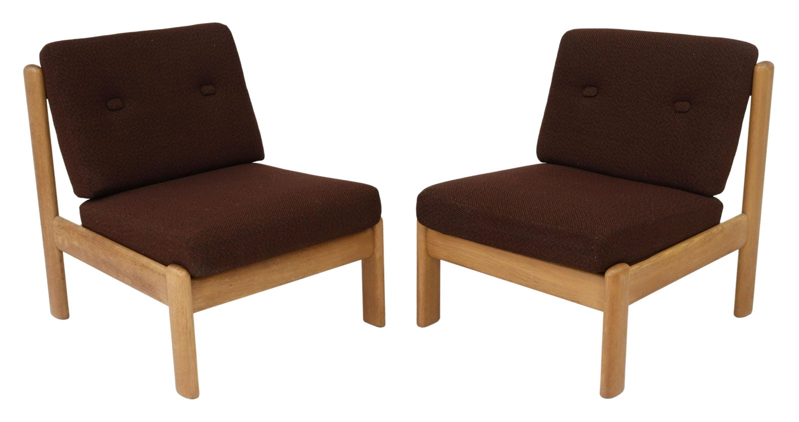 (2) SWEDISH MID-CENTURY MODERN OAK LOUNGE CHAIRS: (pair) Swedish mid-century modern oak framed lounge chairs, c.1960s, having removable brown fabric buttoned cushions, rising on straight legs, approx 28"h, 24.5"w, 28"d Start Price: $150.00