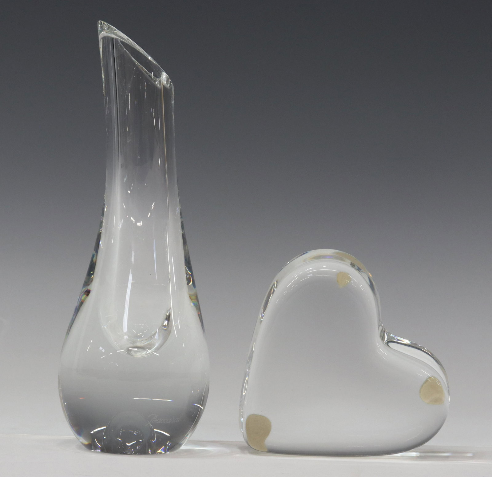 (2) BACCARAT CRYSTAL ALBANE BUD VASE & PAPERWEIGHT: (lot of 2) French Baccarat colorless crystal items, both with acid-etched maker's mark, including: (1) "Albane" bud vase, approx 7"h, 3"diam; (1) heart-form paperweight, approx 1.25"h, 2"w, 3"d; 2.5lb