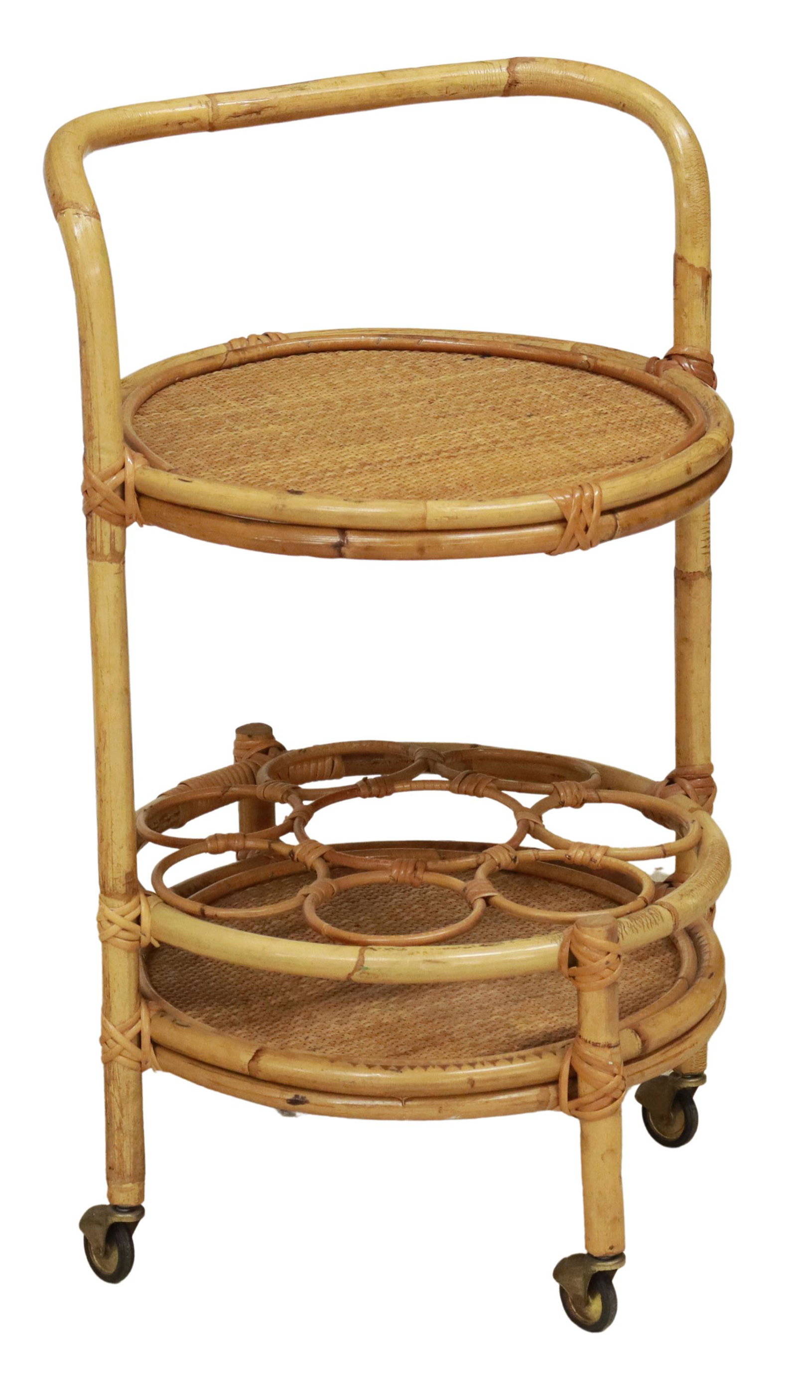 VINTAGE BAMBOO & WOVEN RATTAN SERVICE BAR CART: Vintage bamboo two-tier service trolley/ bar cart, 20th c., two round bamboo tiers, encasing woven rattan tray, lower tier with bottler holder, rising on casters, approx 31"h, 20.5"diam Start Price: $