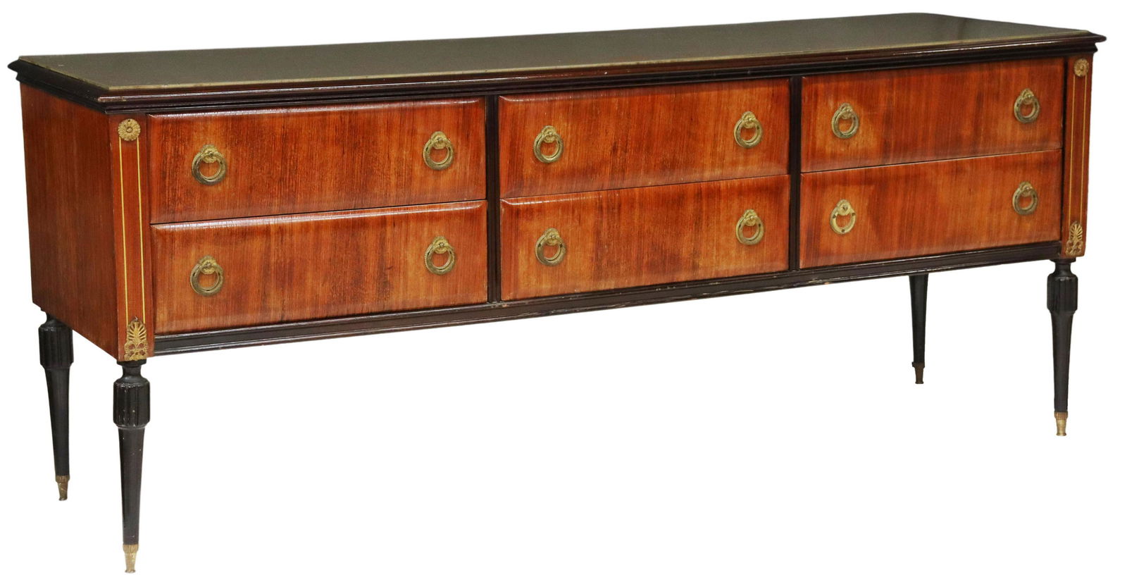 ITALIAN MID-CENTURY MODERN ROSEWOOD COMMODE: Italian mid-century modern rosewood chest of drawers, c.1950s, inset glass top, six drawers, rising on ebonized tapered legs, lacking (one) ring pull, approx 28.5"h, 70.5"w, 20.25"d Start Price: $250.
