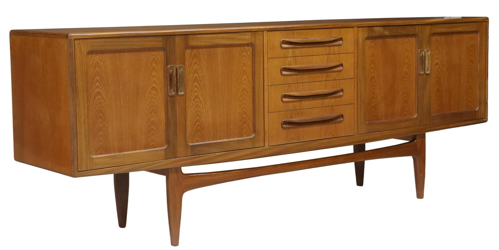 G PLAN 'FRESCO' MID-CENTURY MODERN TEAK SIDEBOARD: Mid-century modern "Fresco" teak sideboard/ credenza, attributed to Victor B. Wilkins for G Plan, c.1960s, case fitted with two double-door cabinets, opening to shelved and storage interiors, centerin
