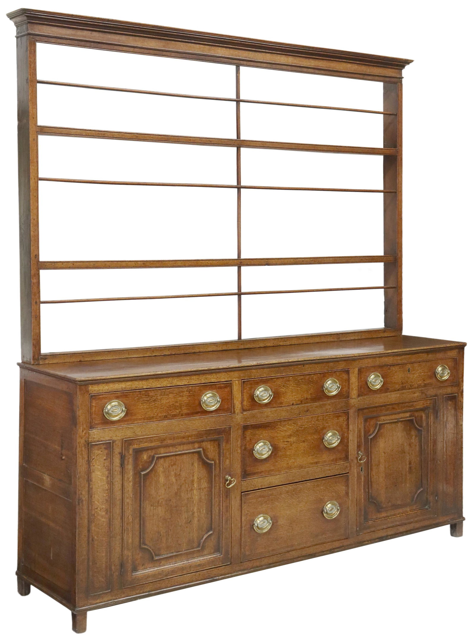 ENGLISH OAK KITCHEN DRESSER/ CUPBOARD: English oak kitchen dresser/ cupboard, 18th/ 19th c., molded cornice, upper rack with three plate groove shelves, lower case fitted with three frieze drawers, over side cabinets, framing two additiona