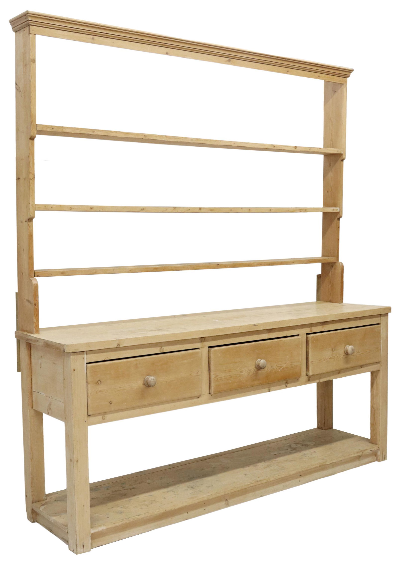 LARGE RUSTIC PINE KITCHEN DRESSER/ CUPBOARD: Rustic English pine kitchen dresser/ cupboard, late 19th/ early 20th c., molded cornice, upper rack with three plate groove shelves, lower case fitted with three deep drawers, legs joined by lower pla