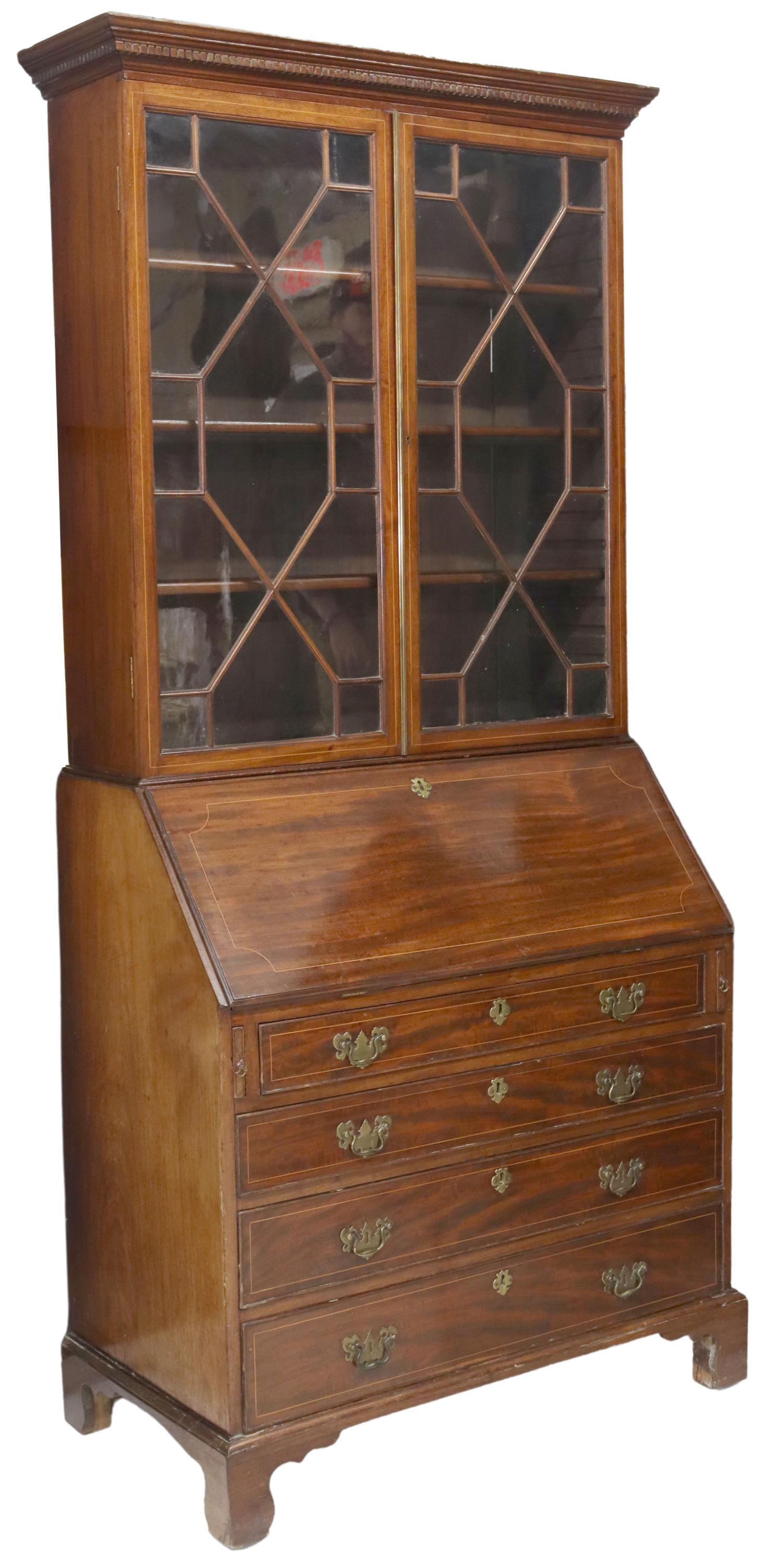 ENGLISH GEORGIAN MAHOGANY SECRETARY BOOKCASE: English Georgian period mahogany secretary bookcase, late 18th c., dentil molded cornice, glazed and mullioned doors, interior shelves, lower case with slant front desk, fitted interior gallery, over 
