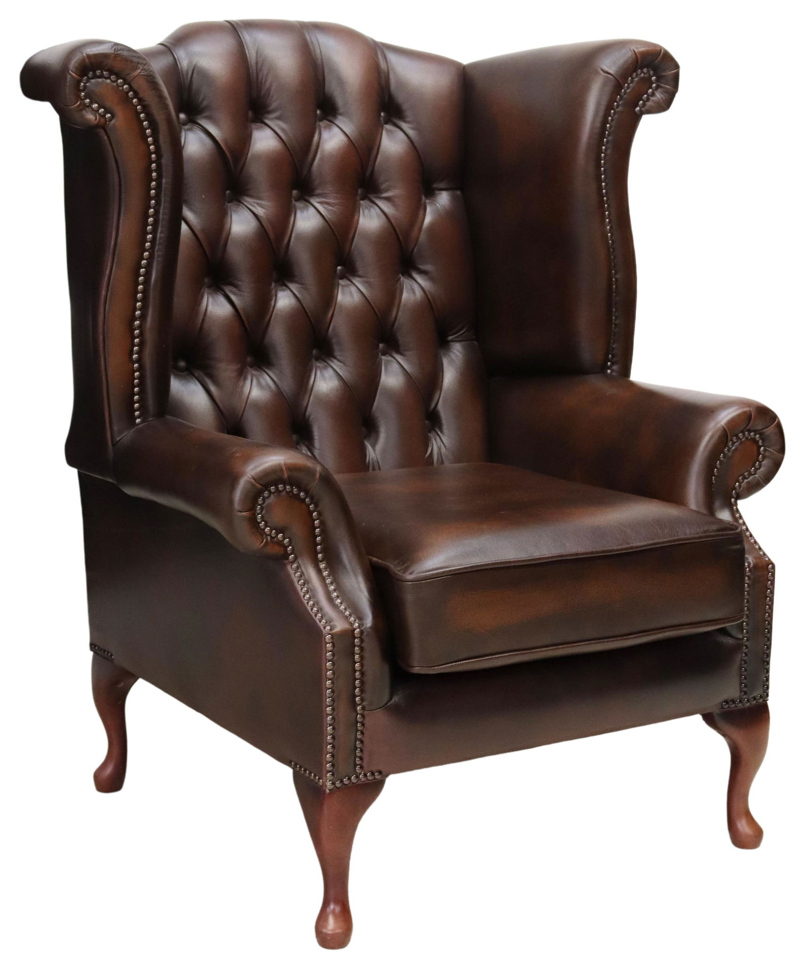 ENGLISH QUEEN ANNE STYLE LEATHER WINGBACK CHAIR: English Queen Anne style wingback armchair, late 20th c., in brown leather upholstery, with button-tufted back, rolled arms, loose seat cushion, nail head trim, rising on cabriole legs, ending in pad