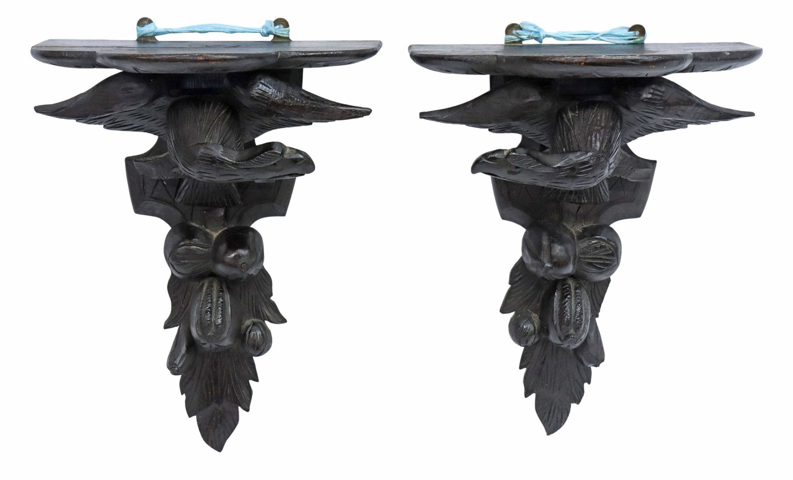 (2) BLACK FOREST CARVED OAK EAGLE WALL BRACKETS: (pair) Black Forest carved oak mounted wall brackets, having shaped top with molded edge, carved eagle, over acorn and foliate motifs, restoration to one bird, approx 19"h, 14.25"w, 9"d Start Price: $