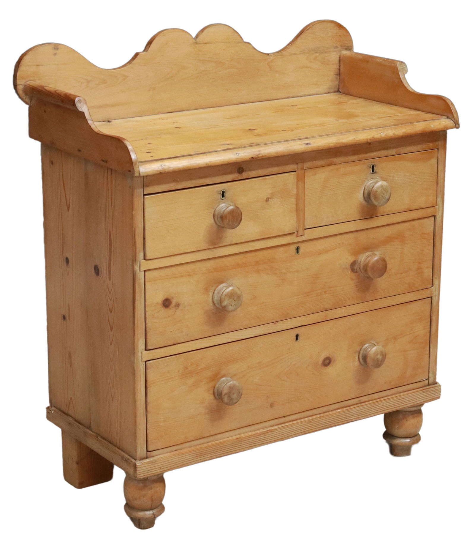 VICTORIAN SCRUBBED PINE CHEST OF DRAWERS: Victorian scrubbed pine chest of drawers, 19th c., scalloped and shaped back and side rails, over rectangular top, fitted with two half drawers, and two full-length drawers, matched wood knobs, rising