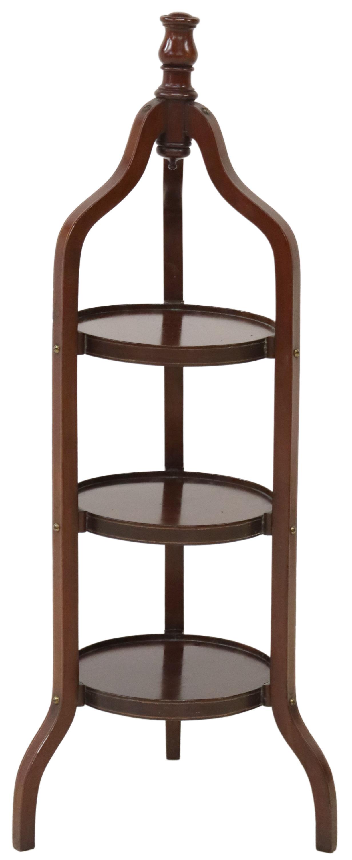 ENGLISH DENBY & SPINKS MAHOGANY CAKE STAND: English mahogany cake/ pie stand, Denby and Spinks, Leeds, 20th c., turned finial, over three round tiers, rising on curved tripartite base, approx 34.5"h, 14"diam, 4.5lbs Start Price: $80.00