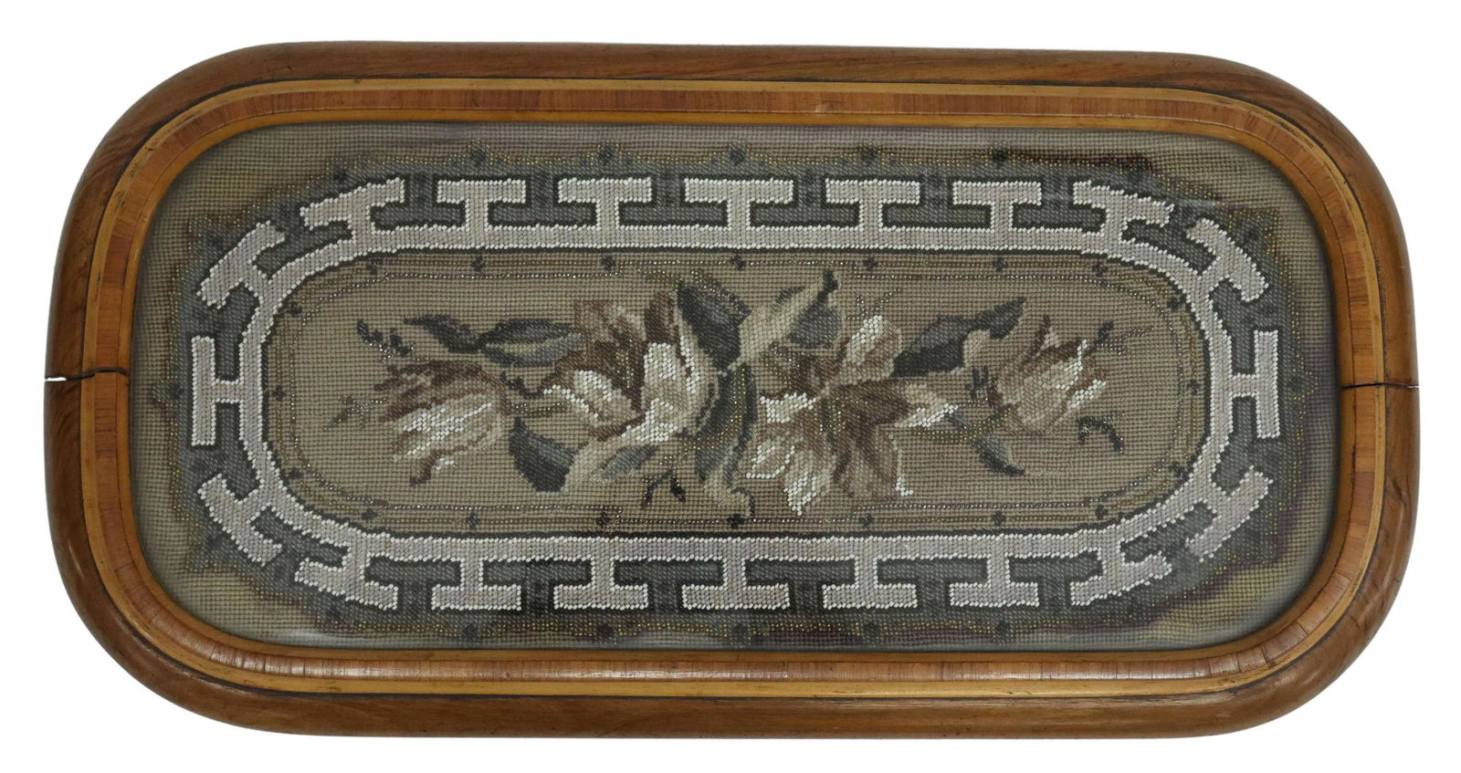 VICTORIAN GLASS-TOP BEADWORK TRAY/ PLATEAU: Victorian tray/ plateau, 19th c., glass top over beadwork picture of flowers, rising on bun feet, approx 2"h, 22.5"l, 11.5"w, 5.75lbs Start Price: $80.00