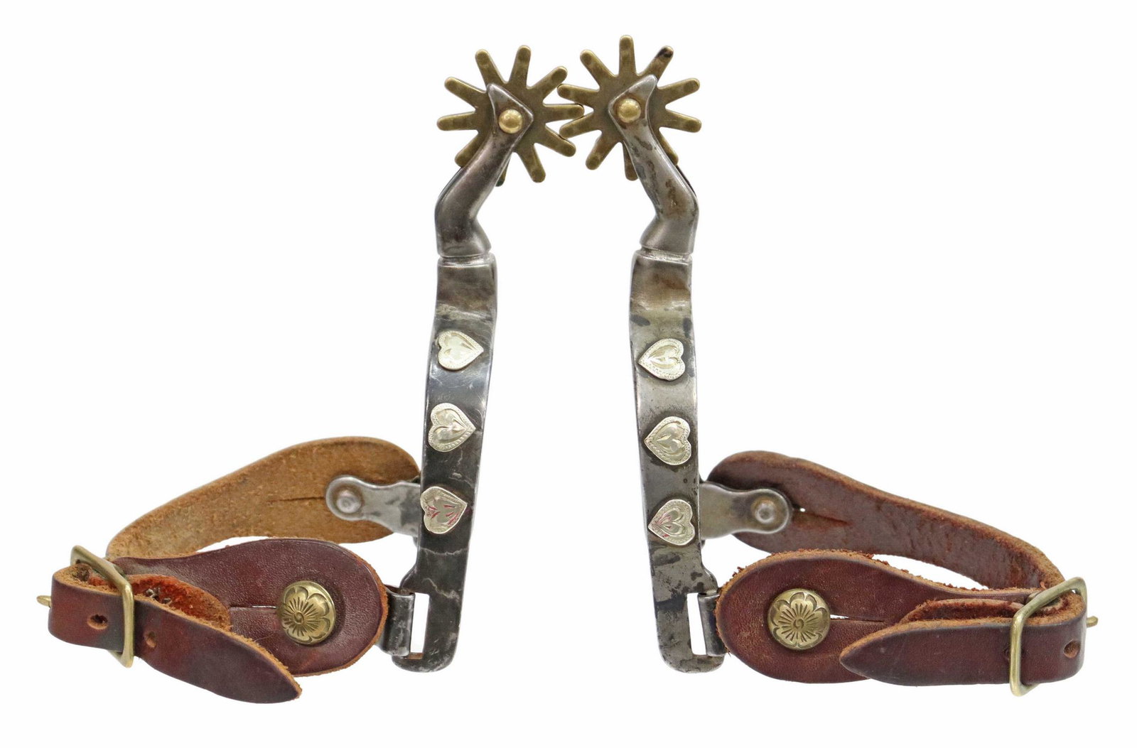 (PAIR) GAL LEG COWBOY SPURS, COLORADO: (pair) Western Gal Leg cowboy spurs, one swing arm marked "Colorado", silver hearts at outside bands, 1.5" rowels, 10 points, brown straps with buckle marked Costa Rica, yoke: approx 2.75"w, 3.25"d, 1