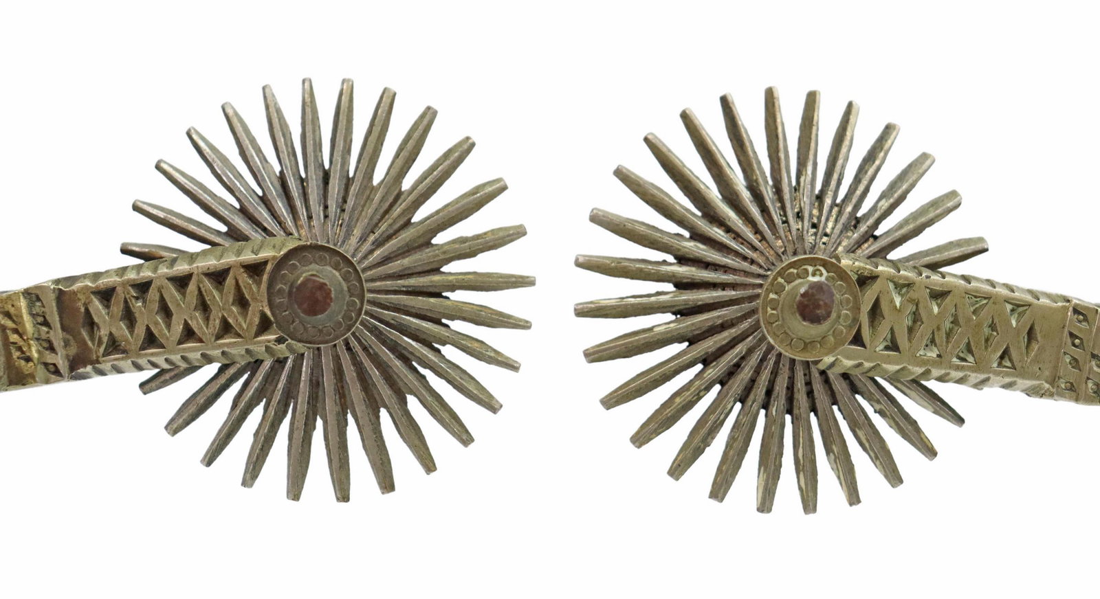 (PAIR) WESTERN COWBOY SPURS: (pair) Western cowboy spurs, likely Mexico, each marked with 0000, foliate, stars and geometric patterns, 2.25" rowels, each with 28 points, yoke: approx 3.25"w, 3.5"d, 1.25lbs total Start Price: $80.