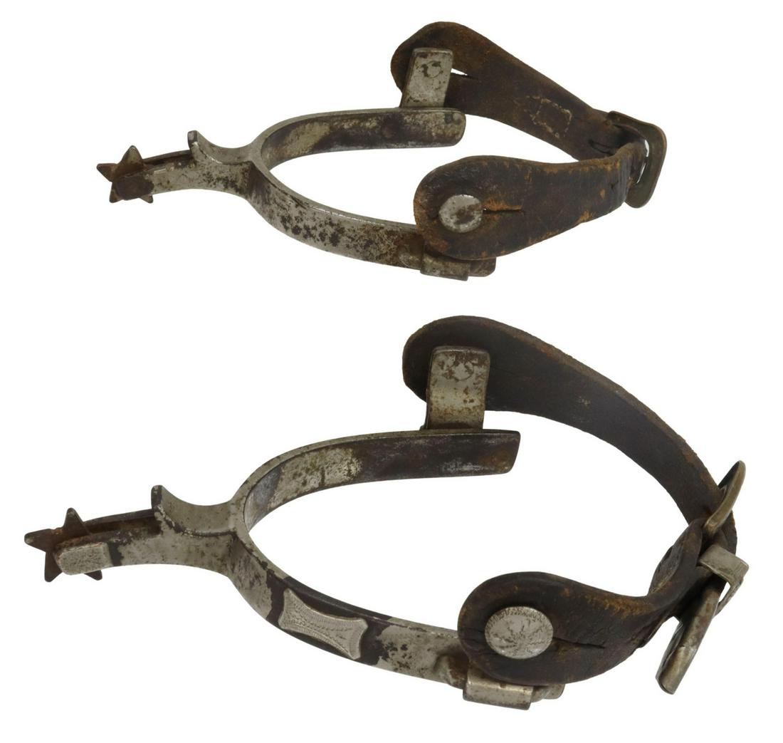 NOCONA McCHESNEY SILVER-MOUNTED COWBOY SPURS: Nocona McChesney silver-mounted cowboy spurs, c.1930s, 5 point 1" rowels, yoke: 3.5"w, 3"d Start Price: $60.00