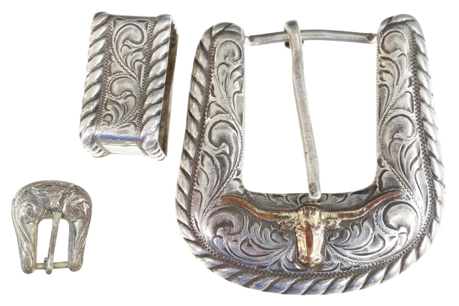 ELK CREEK & HARRY HUDSON STERLING LONGHORN BUCKLES: (lot) Western sterling silver ranger belt buckle set, Elk Creek, rope twist edge, accommodates a belt tapered to approx 1", including: (one) buckle, 14kt yellow gold fill longhorn, approx 2 3/8"l, 2.2