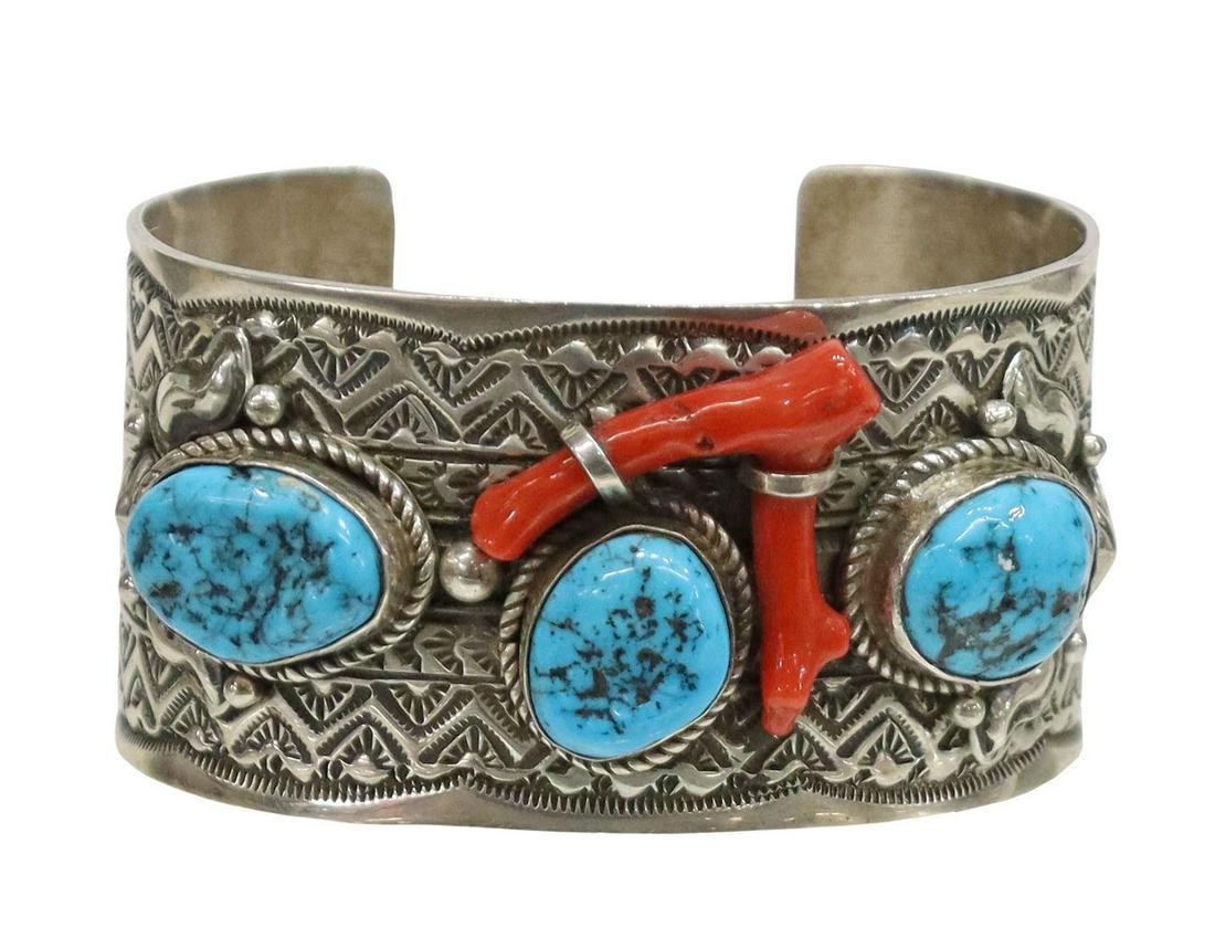 TILLIE JON NAVAJO STERLING TURQUOISE & CORAL CUFF: Native American sterling silver cuff bracelet, Tillie Jon (Navajo/ Dine, 20th c.), bezel-set turquoise, red coral branch, stamp work cuff, approx 1.5"w, interior: approx 6"l, gap: approx 1 1/8"w, 82.7