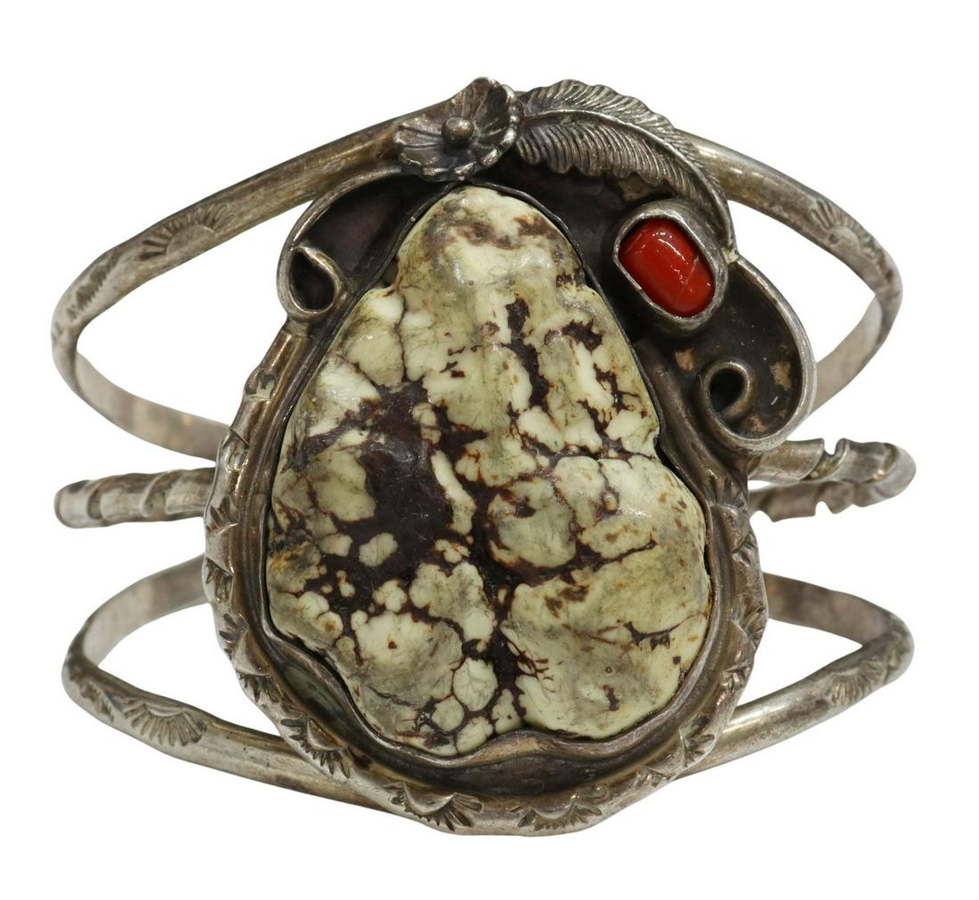 GARY EDWARDS NAVAJO STERLING & STONE CUFF: Native American sterling silver cuff bracelet, signed GE (Gary Edwards, Navajo, 20thc.), a large central free-form Buffalo turquoise stone, under floral and feather detail, with red coral accent, trip
