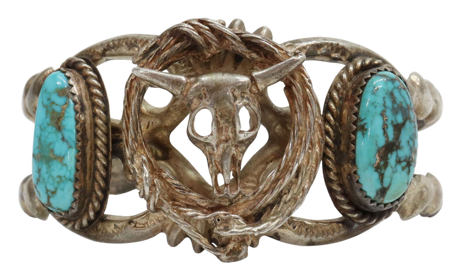 FRANCIS L. BEGAY NAVAJO STERLING & TURQUOISE CUFF: Native American sterling silver cuff bracelet, signed F.L. Begay (Francis L. Begay, Navajo/Dine, 20thc.), two-prong cuff, centering a bison skull and rope, flanked by two bezel set turquoise stones, i