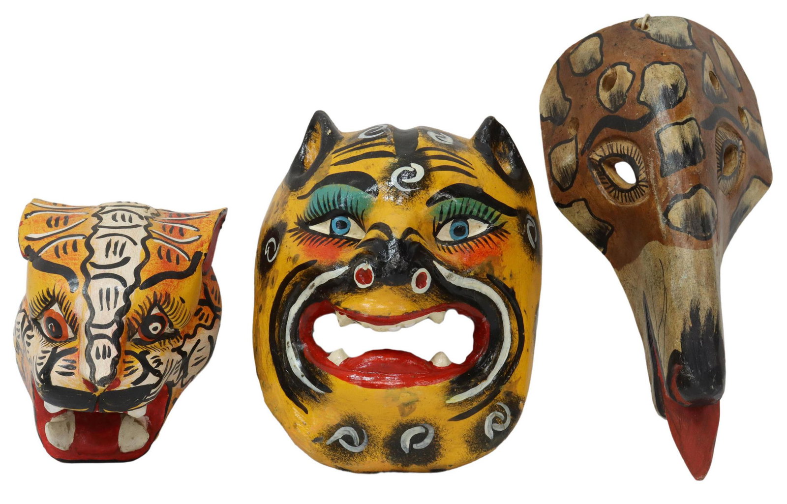 3) MEXICO FOLK ART PAINTED ANIMAL MASKS, JAGUAR: (lot of 3) Folk art animal form masks, Mexico, all carved and polychrome painted, including: (2) jaguar masks, (one) a dance mask with open mouth, (one) a small jaguar head, (1) elongated animal mask 