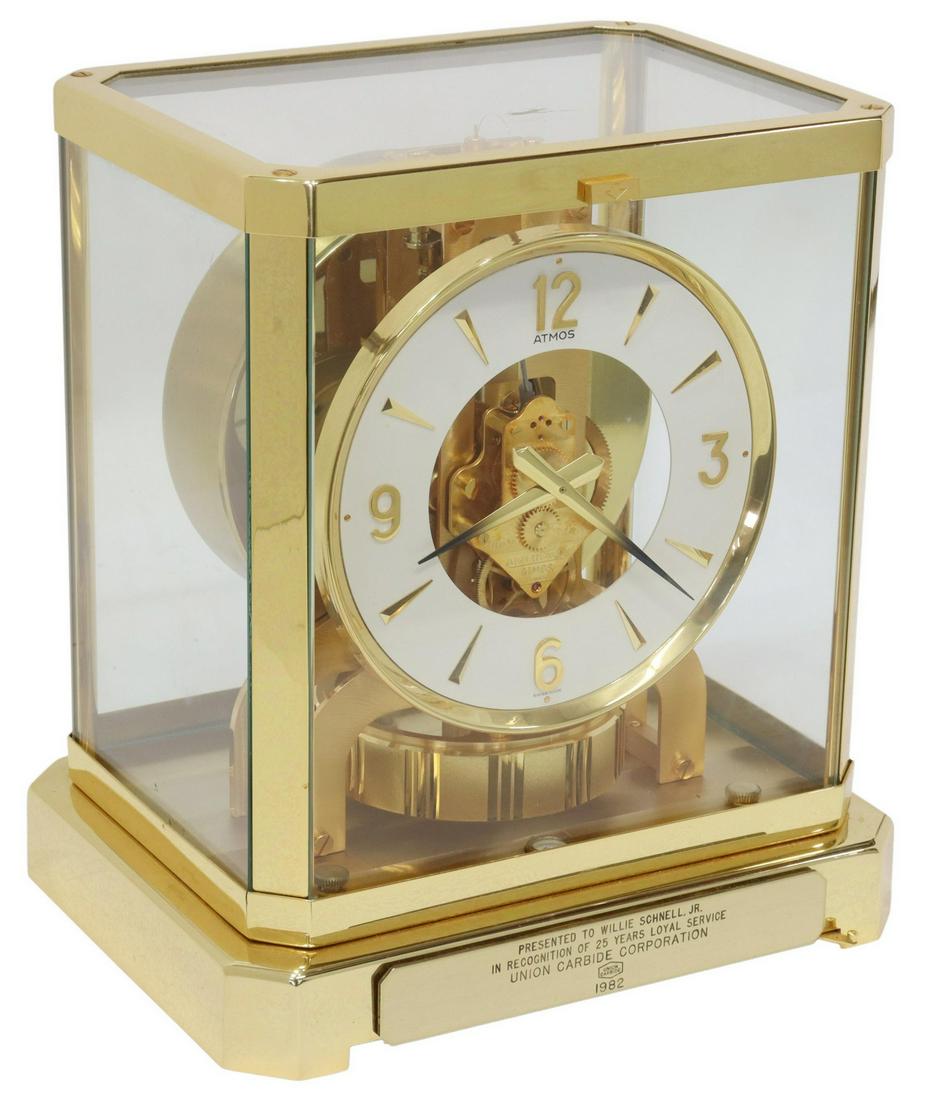 SWISS JAEGER-LECOULTRE GILT-BRASS ATMOS CLOCK: Swiss "Atmos" clock, Jaeger-LeCoultre, late 20th c., gilt-brass case, with glazed viewing panels, chapter ring with baton and Arabic numeral hour markers at the 12, 3, 6, and 9 o'clock positions, fift