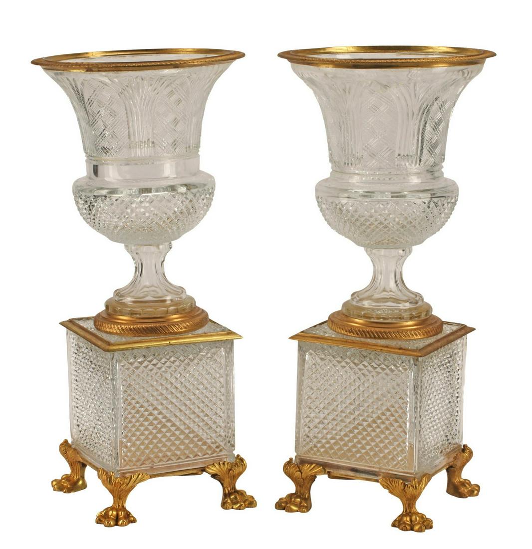 (2) BACCARAT STYLE ORMOLU-MOUNTED CUT CRYSTAL URNS: (pair) Baccarat style cut crystal urns, with bronze dore mounts, approx 21"h, 10"diam, 40lbs total Start Price: $400.00