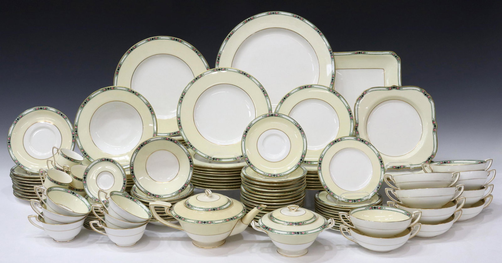 (129) ROYAL WORCESTER PORCELAIN DINNER SERVICE: (lot of 129) English porcelain partial dinner service, Royal Worcester, early 20th c., having hand painted rose and diamond floral trim, gilt accents, on white and yellow ground, all with makers mark 