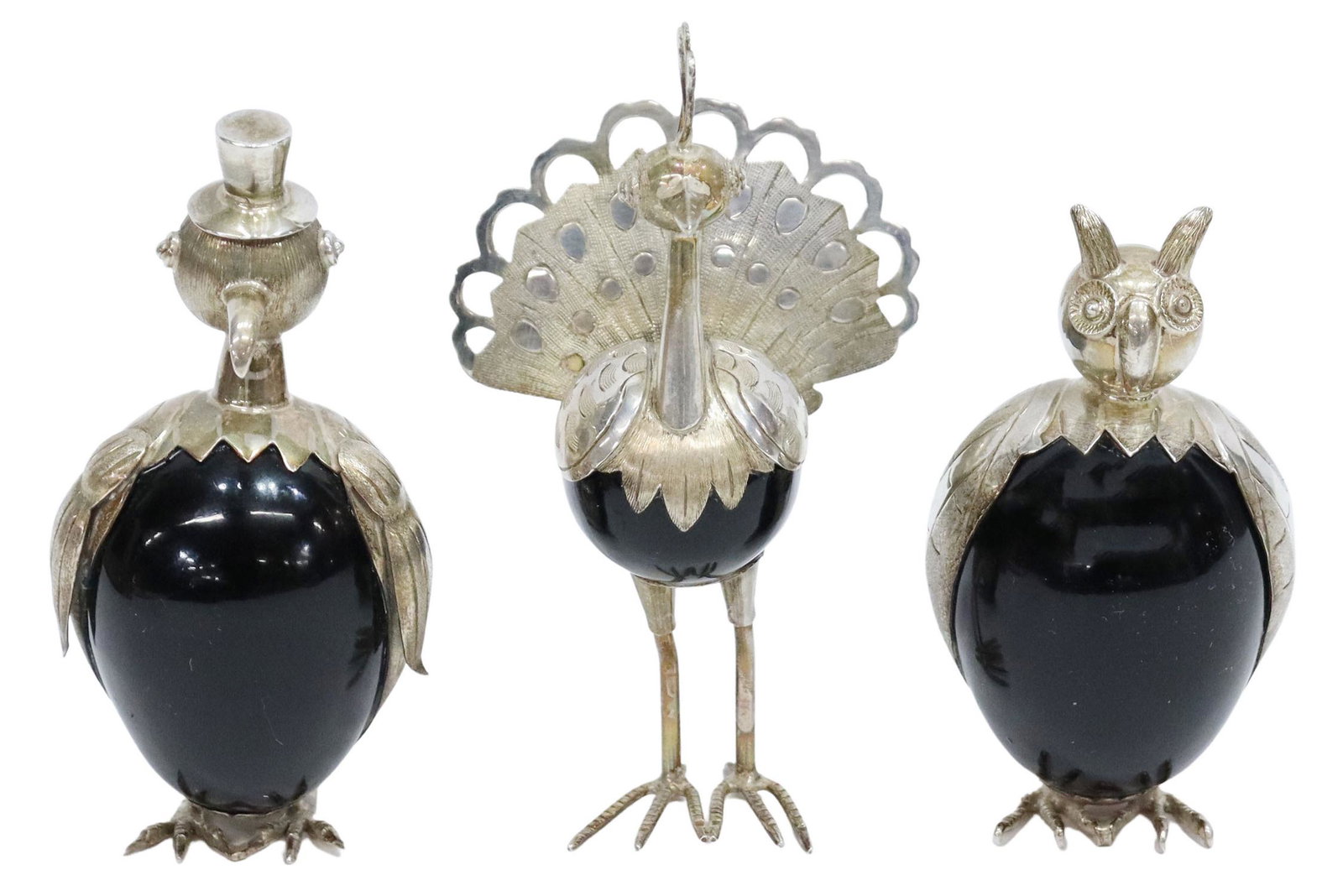 (3) STERLING & ONYX BIRD FIGURES, TAXCO, MEXICO: (lot of 3) Sterling silver and onyx bird figures, Taxco, Mexico, 20th c., including: (1) owl, marked TR-104, (1) penguin wearing top hat, partially obliterated mark, (1) peacock, marked TM-33, largest