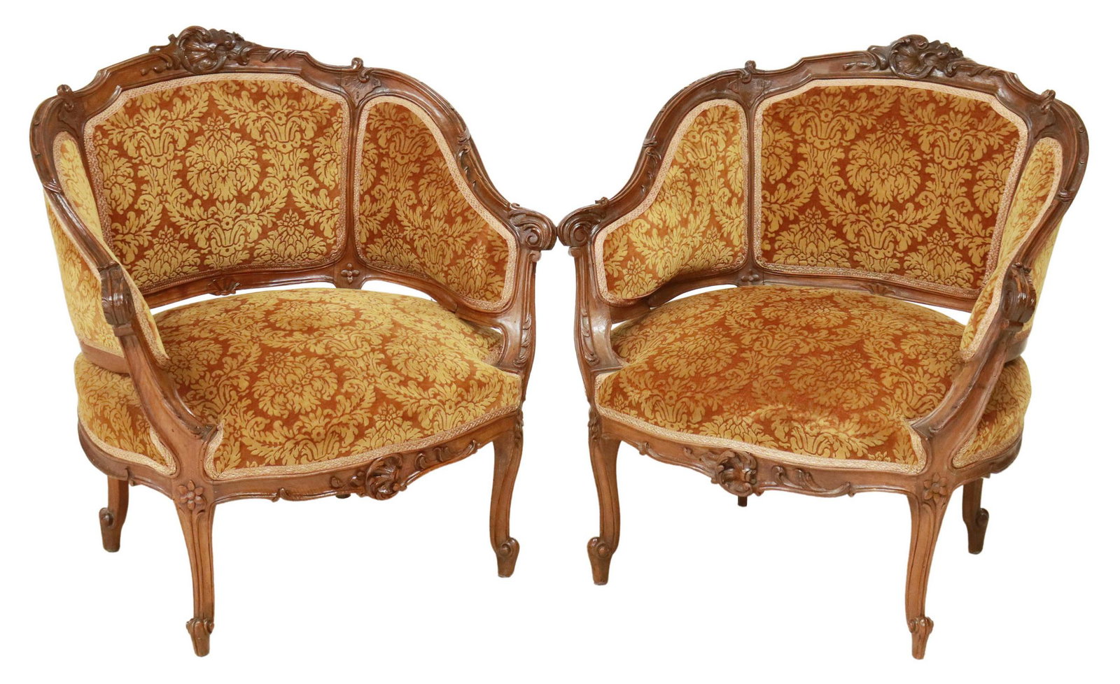 (2) ITALIAN LOUIS XV STYLE UPHOLSTERED BERGERES: (pair) Italian Louis XV style armchairs, 20th c., carved foliate crest, back and seat in damask upholstery, with carved acanthus arms, rising on cabriole legs, ending in whorl feet, approx 31"h, 28.75