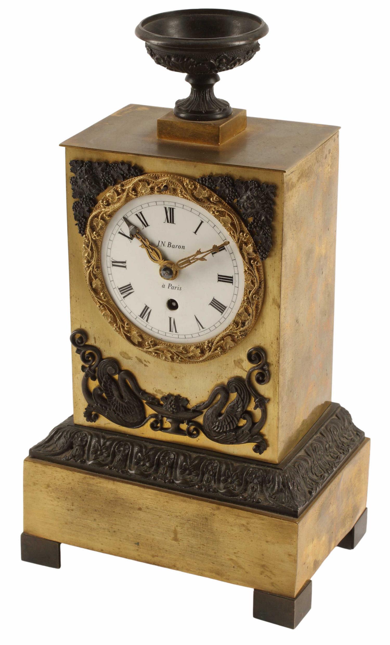 FRENCH NEOCLASSICAL STYLE MANTEL CLOCK: French Neoclassical style clock, 19th c., urn-form finial, white enamel dial signed J.N. Baron a Paris, Roman numeral hour markers, time-only movement, lacking pendulum, approx 11.5"h, 6"w, 4"d Start 