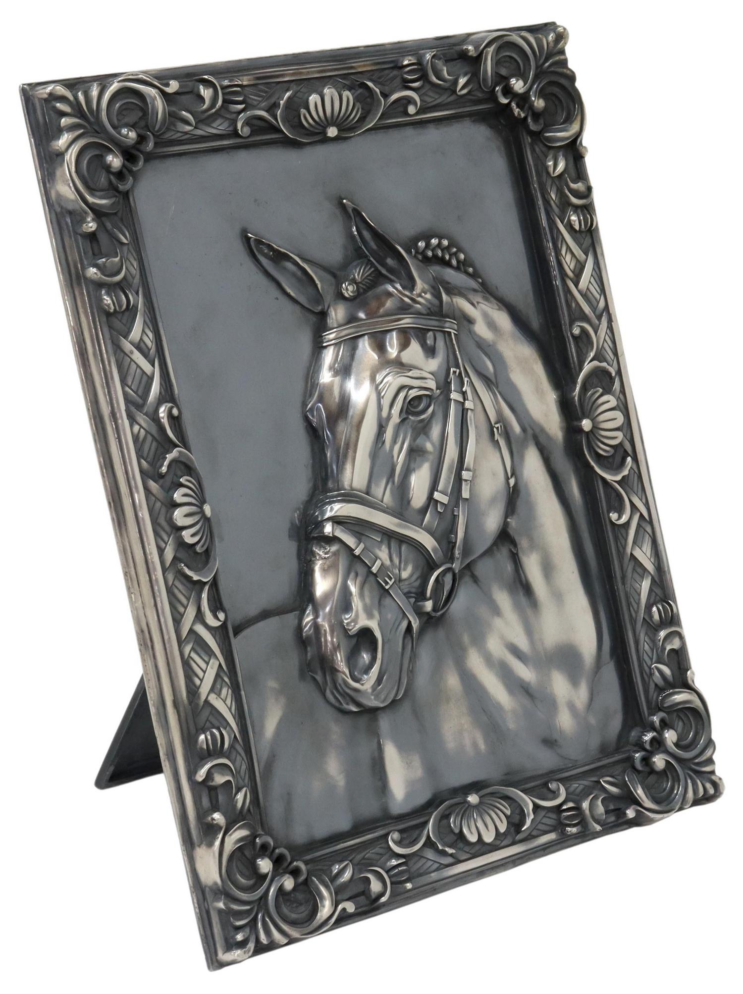 JAPANESE FINE SILVER HORSE RELIEF PLAQUE: Japanese fine silver plaque, retailed by Kamiwaza, with racehorse head in relief, integral frame, easel back, "jungin" (pure silver) character mark, approx 10.75"h, 8.25"w, 38.22ozt Start Price: $900.