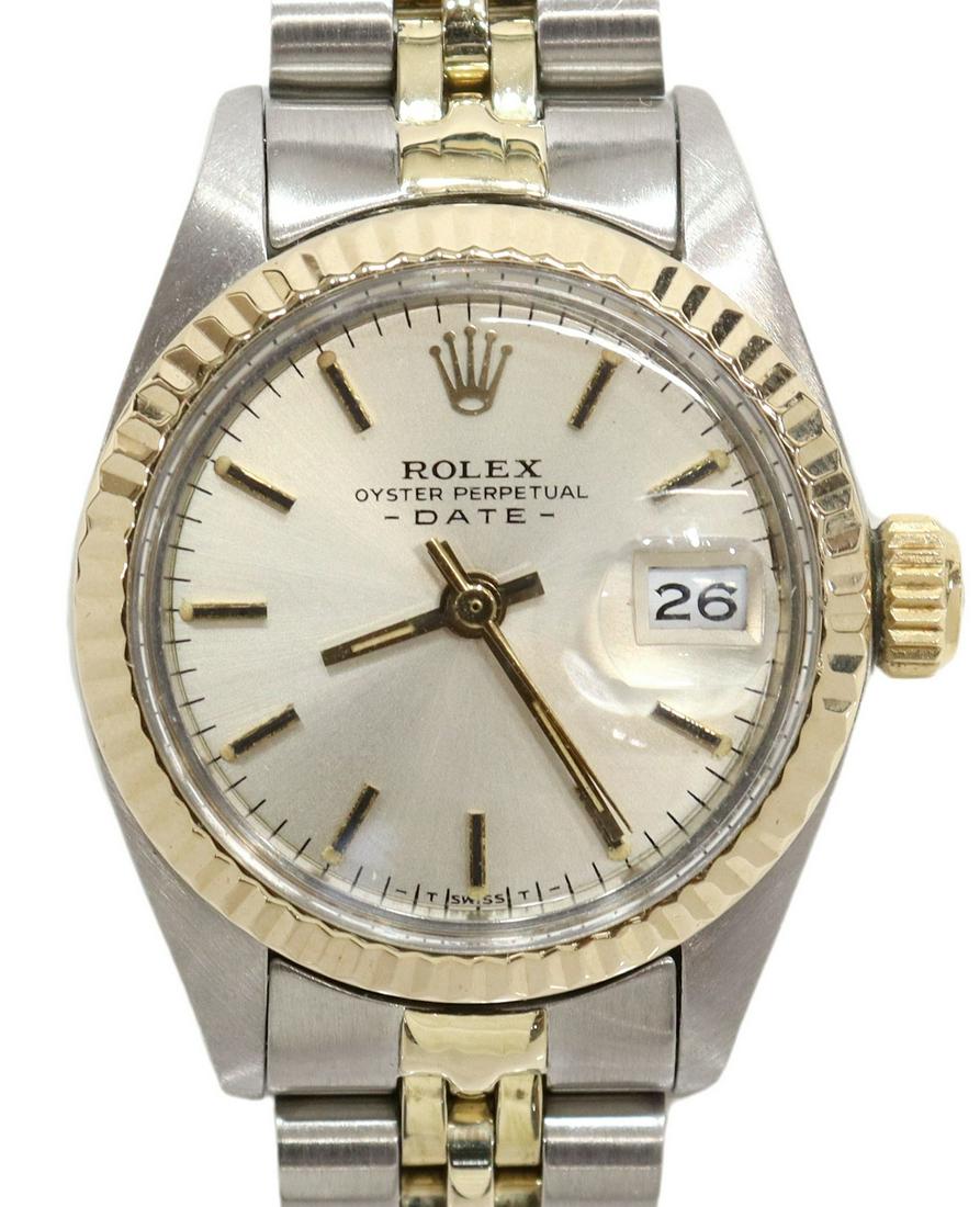 LADY'S ROLEX OYSTER PERPETUAL DATEJUST WATCH: Lady's Rolex Oyster Perpetual DateJust wristwatch, with gold bezel, gold baton indexes, on a two-tone gold and stainless steel Jubilee bracelet, case: approx 25mm, 50.2 grams total (inclusive of all m