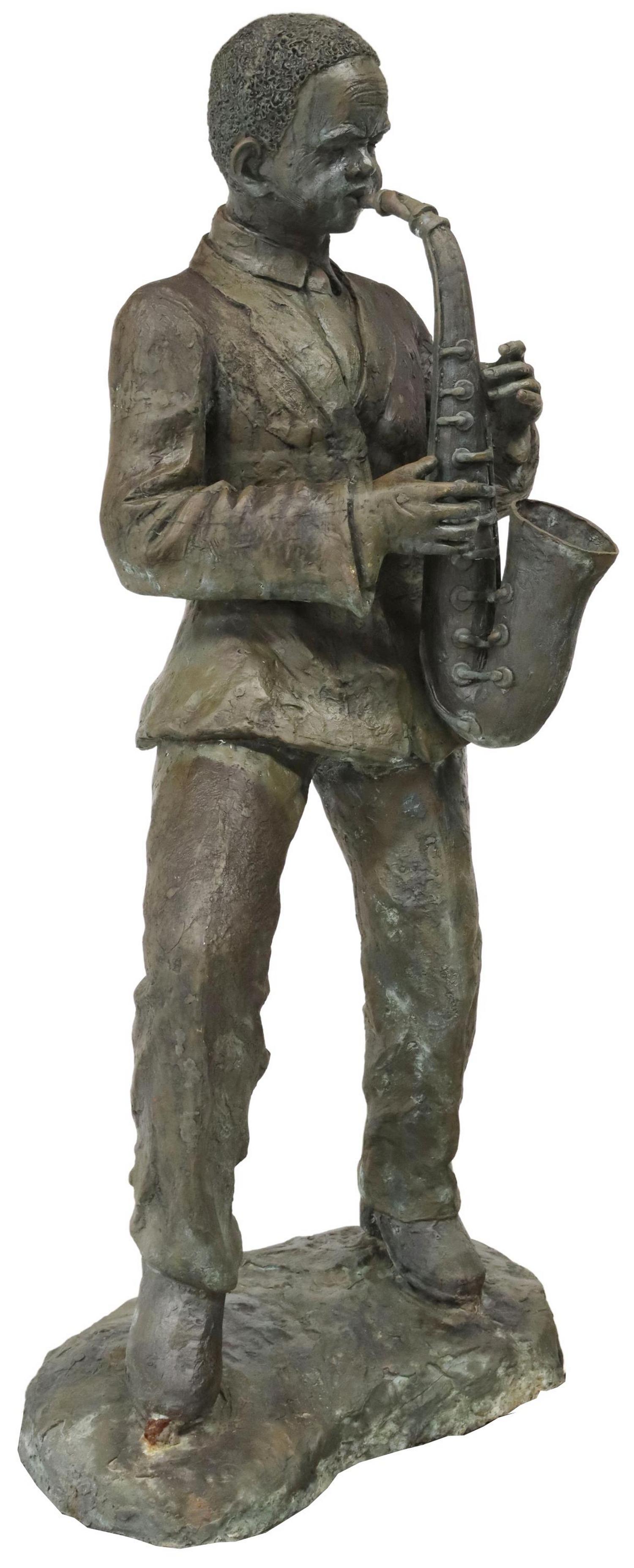 NEAR LIFE-SIZE PATINATED BRONZE MUSICIAN SCULPTURE: Near life-sized patinated bronze sculpture, 20th c., depicting a Swing-era saxophone musician, on rounded pedestal, with illegible marking at base, approx 62"h, 30"w, 19"d Start Price: $750.00