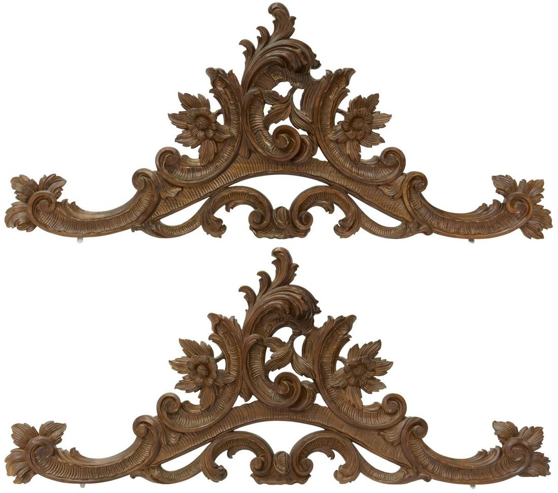 (2) ITALIAN ROCOCO REVIVAL ARCHITECTURAL CRESTS: (lot of 2) Italian Rococo Revival carved walnut architectural crests, 20th c., having scrolled floral and foliate accents, approx 18.5"h, 44"w, 2.5"d, 8lbs total Start Price: $200.00
