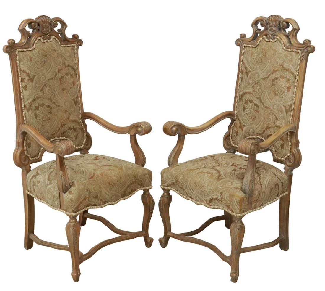 (2) LOUIS XV STYLE PARCEL GILT HIGHBACK FAUTEUILS: (pair) Louis XV style walnut highback armchairs, 20th c., having carved shell crest, over frame with parcel gilt painted touches, paisley upholstery to back and seat, with twisted rope trim, approx 55