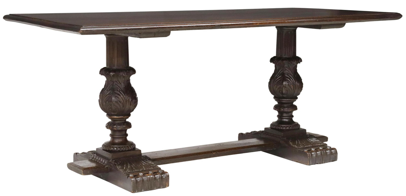 ITALIAN RENAISSANCE REVIVAL CARVED WALNUT TABLE: Italian Renaissance Revival carved walnut dining table, early 20th c., having rectangular top, over carved legs with ribbed accents and foliate motifs, joined by center stretcher, ending in curved fee