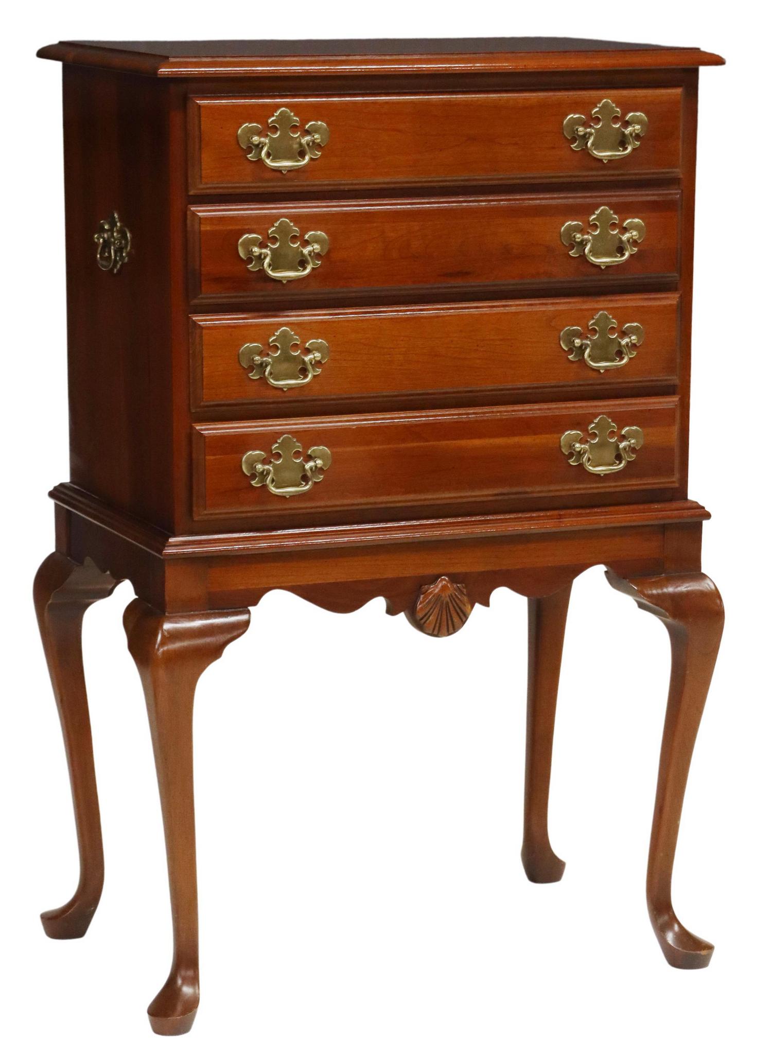 QUEEN ANNE STYLE LINED CHERRYWOOD SILVER CHEST: Queen Anne style silver chest, possibly cherrywood, late 20th c., having four drawers, with tarnish resistant liner, gilt metal batwing pulls, over carved shell apron, rising on cabriole legs, ending 