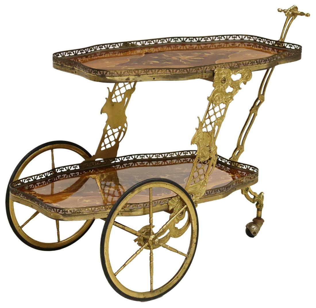 ITALIAN GILT METAL & MARQUETRY TIERED SERVICE CART: Italian gilt-metal and marquetry two-tier trolley/ service cart, 20th c., pierced gallery encasing two shaped floral marquetry trays, rising on front spoke wheels and one caster, approx 27.25"h, 33"l,
