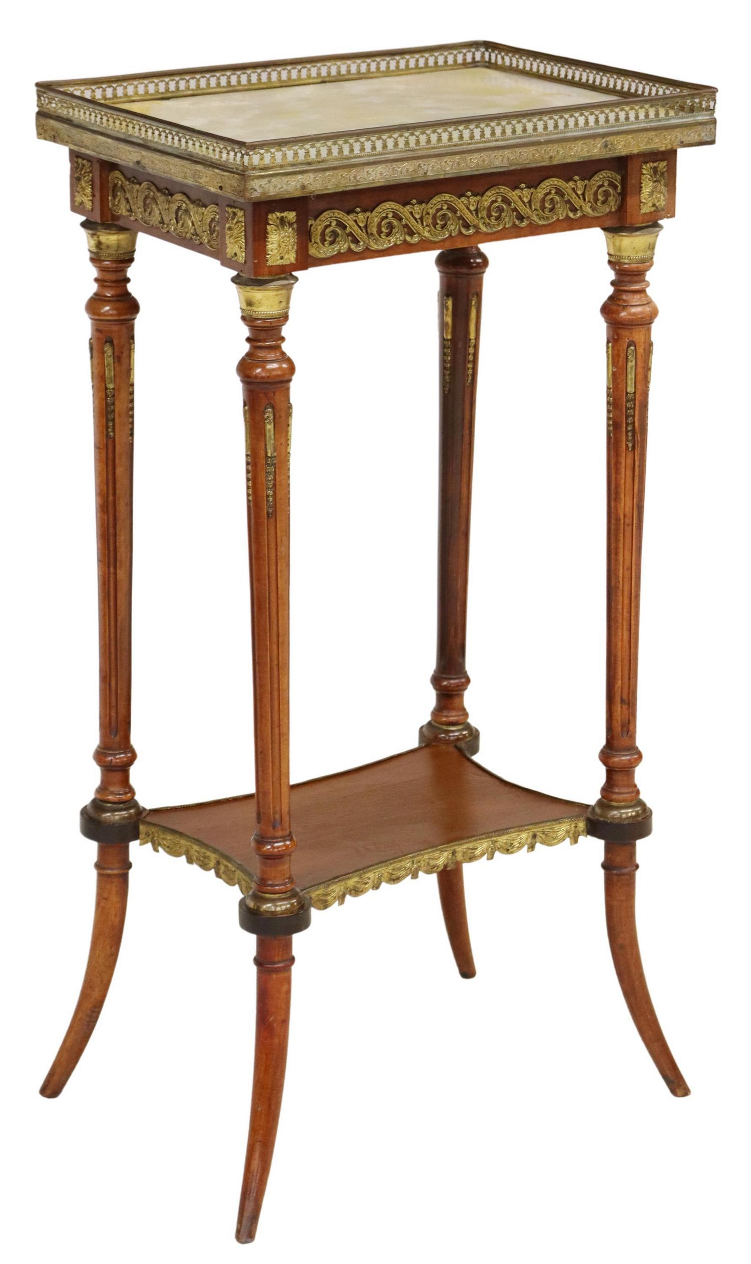 FRENCH LOUIS XVI STYLE ONYX-TOP STAND SIDE TABLE: French Louis XVI style stand/ side table, 20th c., pierced gilt metal gallery enclosing the onyx top, over apron with gilt metal rinceau mounts, fluted supports joined by medial shelf, ending in saber