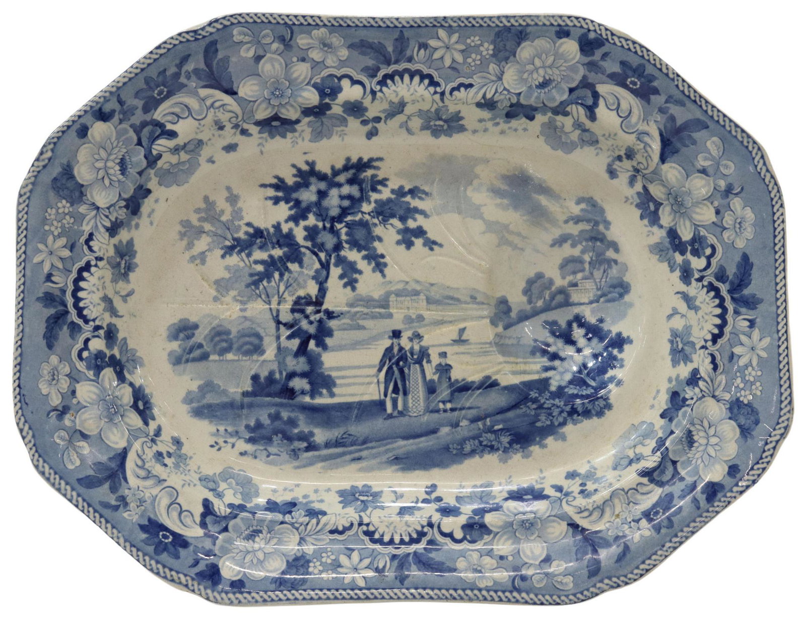 ENGLISH STAFFORDSHIRE WELL-AND-TREE MEAT PLATTER: English Staffordshire transferware well-and-tree meat platter, 19th c., floral border, central view of Eton College, impressed three loop knot mark, small chip underfoot, approx 3.25"h, 18"l, 13.75"w,