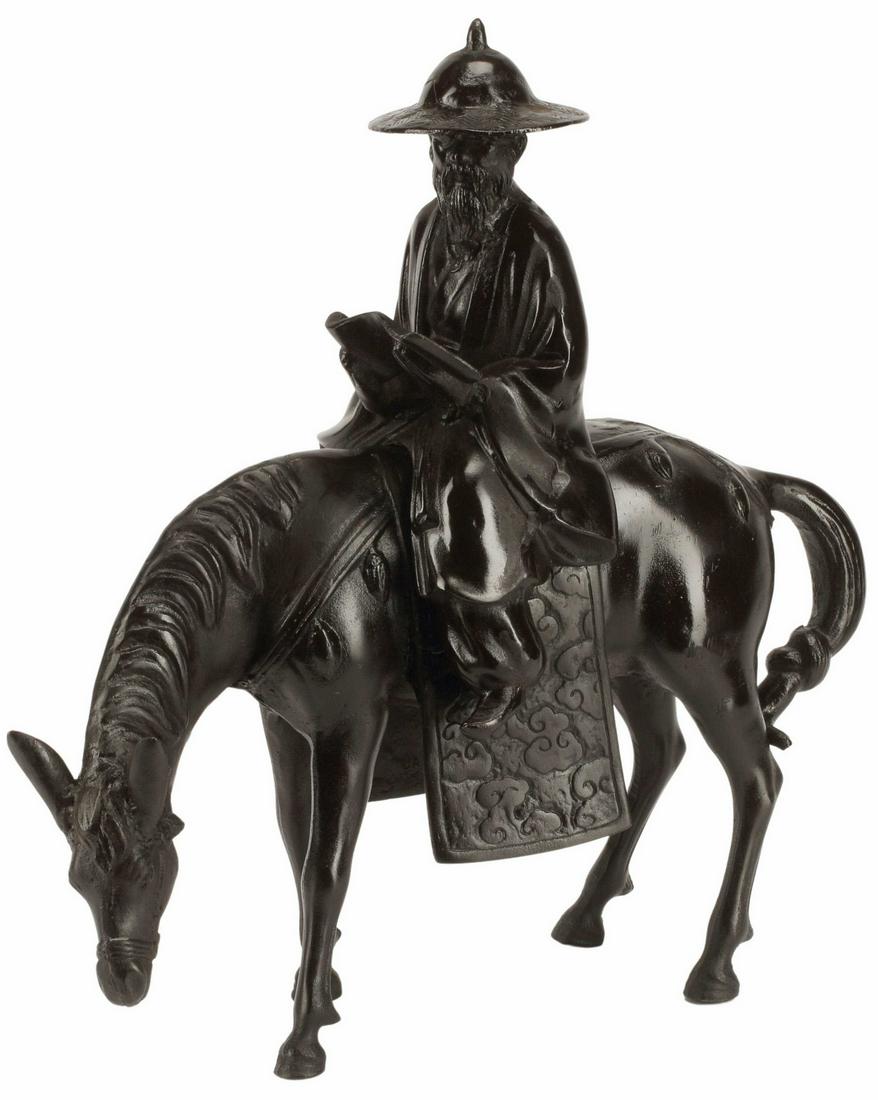 JAPANESE CAST IRON SCHOLAR ON HORSEBACK: Japanese cast iron figure of a scholar on horseback, marked Japan at underside of blanket, approx 18"h, 17"l, 7.5"w, 24lbs Start Price: $150.00