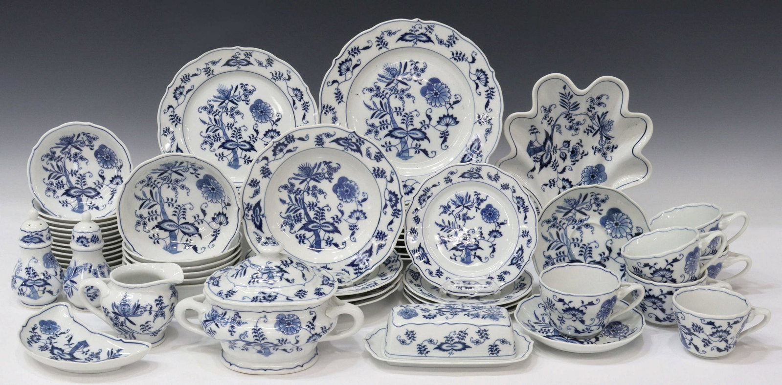 (55) BLUE DANUBE/ BLUE ONION DINNER SERVICE: (lot of 55) Blue Danube/ Blue Onion dinner service, Japan, mid to late 20th c., assembled, most pieces with boxed backstamp/ mark, including: (10) dinner plates, (one) with varied banner mark, 10.25"d