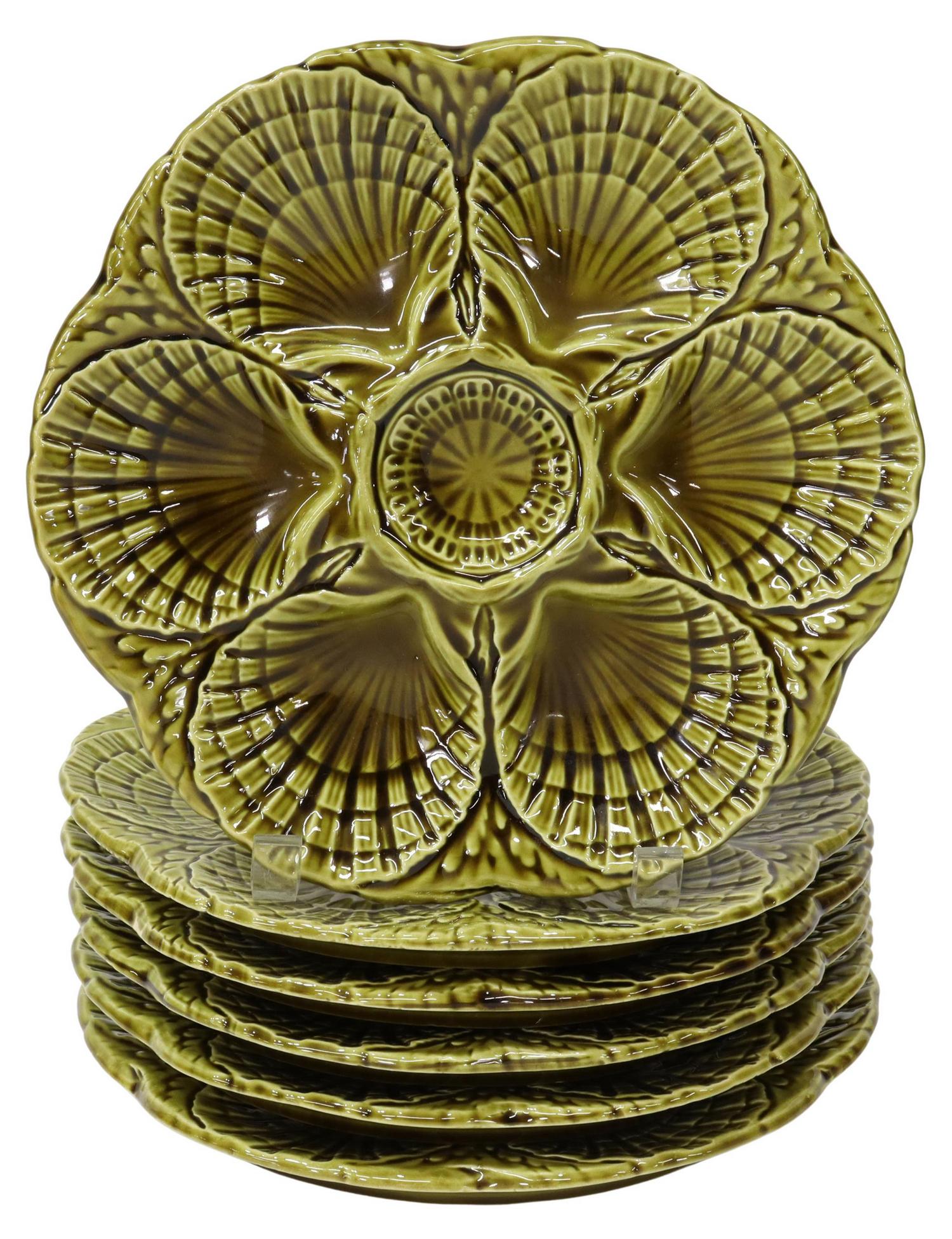 (6) FRENCH SARREGUEMINES FAIENCE OYSTER PLATES: (lot of 6) French Sarreguemines faience oyster plates, 20th c., in green glaze, with scallop shell shaped wells, approx 9.5"diam; 8lbs total Start Price: $80.00
