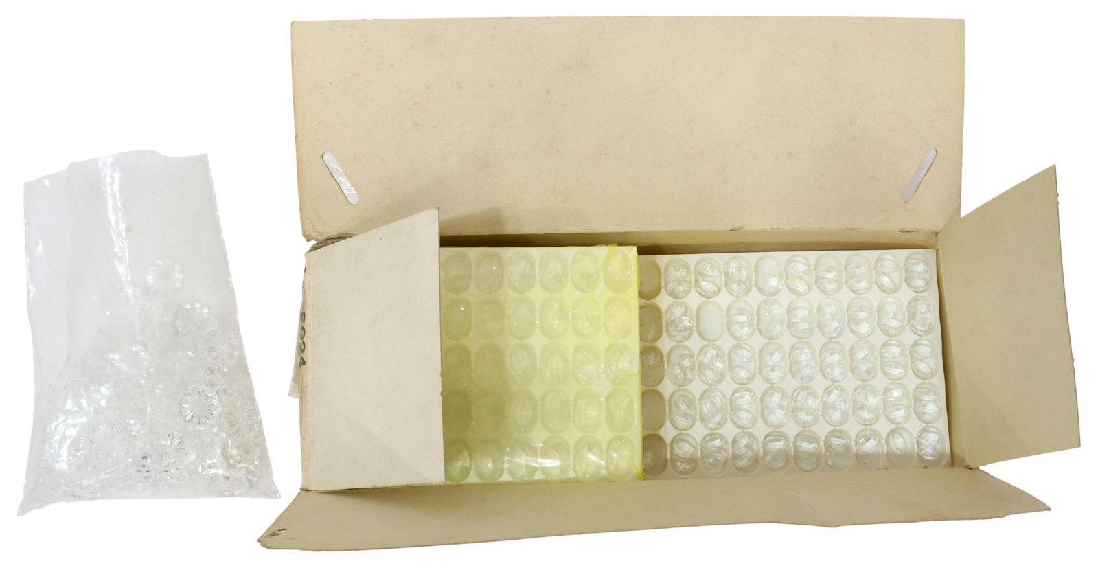 (LOT) CHANDELIER CRYSTAL SWAG, POSSIBLY SWAROVSKI: (lot) Crystal parts and pieces to create chandelier swag, presented in Swarovski box, possibly of Swarovski origin, including: (1) bag of floral accents, (13) trays of variously sized pendants, nine r