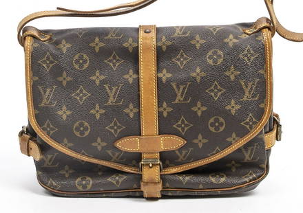 LOUIS VUITTON "SAUMUR" MONOGRAM CROSSBODY BAG: Louis Vuitton "Saumur" crossbody bag, in brown and tan monogram coated canvas, with brass hardware, tan vachetta leather trim, adjustable flat shoulder strap, dual compartments at exterior, brown