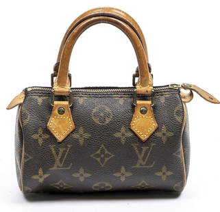 LOUIS VUITTON "MINI SPEEDY" MONOGRAM HANDBAG: Louis Vuitton "Mini Speedy" handbag, in brown and tan monogram coated canvas, with brass hardware, tan vachetta leather trim, dual rolled handles, brown canvas lining, zip closure at top, patination,