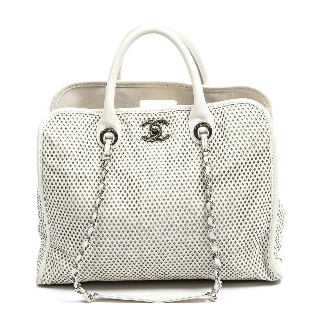 CHANEL "UP IN THE AIR" PERFORATED LEATHER BAG: Chanel "Up In The Air" shoulder bag, in ivory perforated leather, with silver-tone hardware, dual rolled handles and interlaced chain/leather shoulder straps, "CC" twist closure at front, fabric-lined